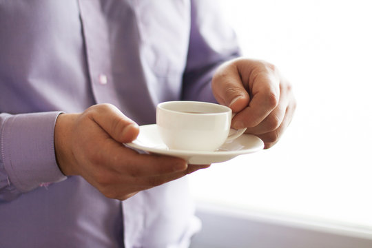 Businessman holding a cup of coffee