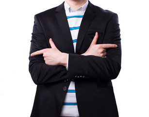 A businessman stands with his arms crossed