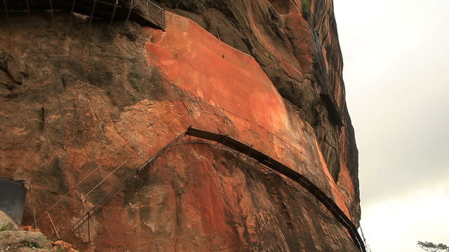 Scaffolds for walking fixed on steep rocks in Sigiriya.