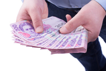 Businessman counts money in hands.