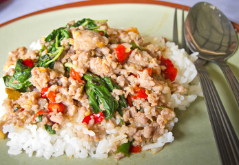Rice topped with stir fried pork and basil