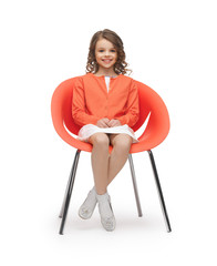 pre-teen girl in casual clothes sitting on chair