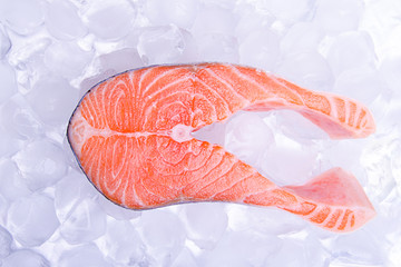 One slice of red fish -salmon, on ice