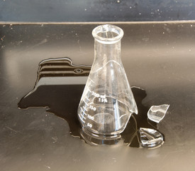 Broken flask on a lab bench