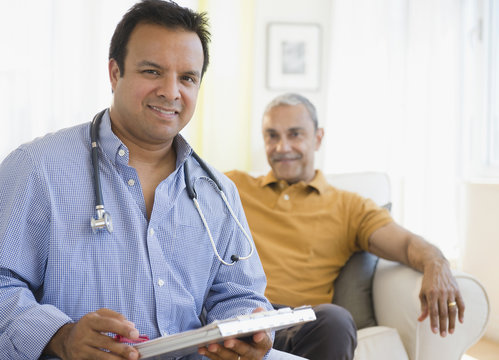 Hispanic Doctor Examining Patient