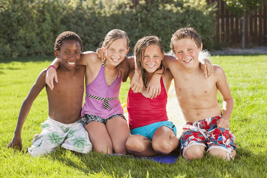 Friends hanging out together in yard