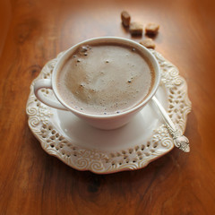 Coffee cup  on a wooden background
