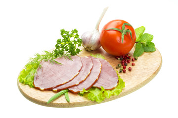 Fototapeta na wymiar Ripe fresh ham with vegetables