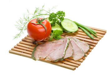 Ripe fresh ham with vegetables