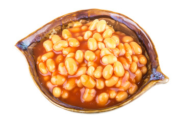 Marinated haricot beans in tomato sauce with shallots on a plate