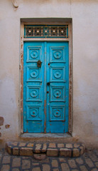 Traditional entrance blue door in Tunisia