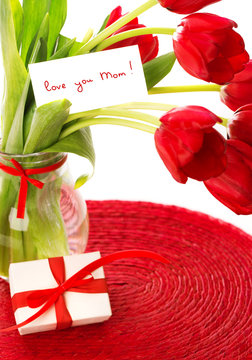 Red tulips with postcard