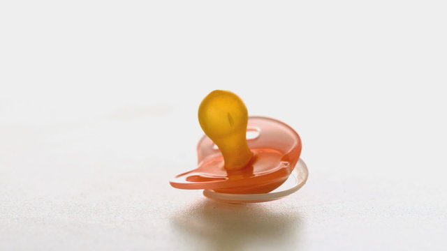 Yellow soother spinning on a surface