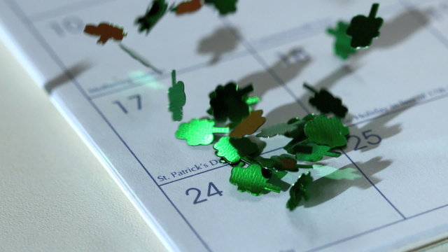 Shamrock confetti falling on calander