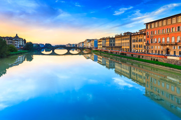 Florence, carraia medieval bridge on Arno river on sunset