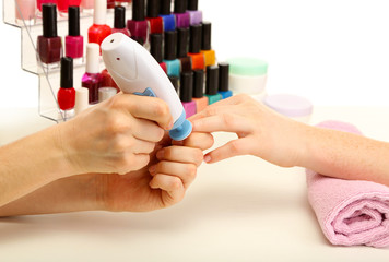 Manicure process in beauty salon, close up