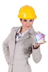 Architect with a house made of money