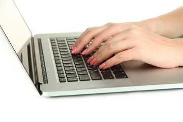 Female hands writing on laptop, isolated on white