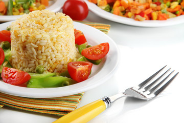 Delicious risotto with vegetables isolated on white
