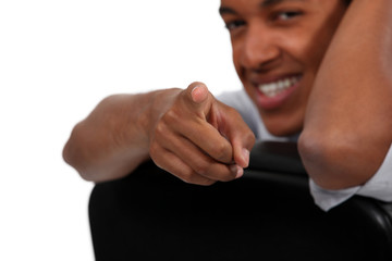 Man sitting on chair pointing