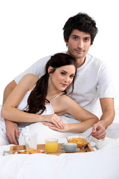 couple having breakfast in bed