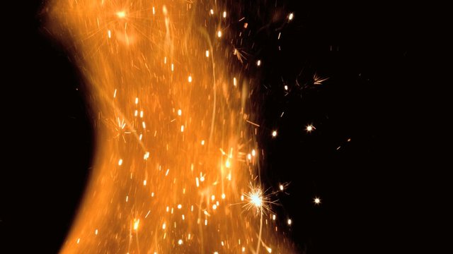 Close up of flame with sparks