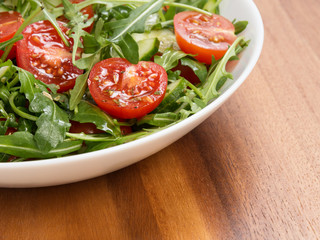 salad from ruccola, cherry tomatoes and cucumber