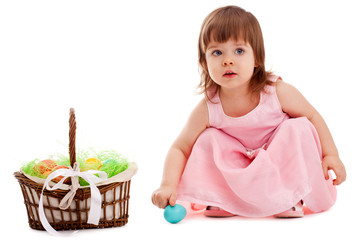 little girl playing with eater eggs