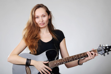 Fototapeta premium Young woman with guitar
