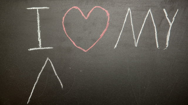 I love my mum message appearing drawn on blackboard with chalk