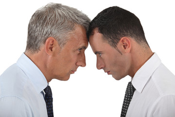 Businessmen stood head-to-head