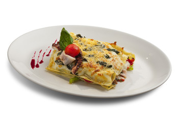 lasagna with seafood in white plate