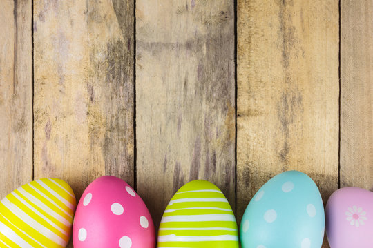Dyed easter eggs on a wooden background
