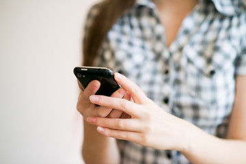 A woman uses a mobile phone