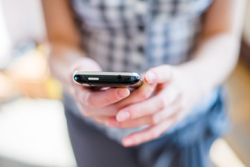 A woman uses a mobile phone