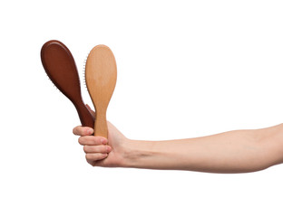 A hairbrush in a female hand