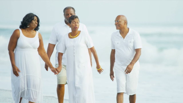 Senior African American Friends Walking Beach