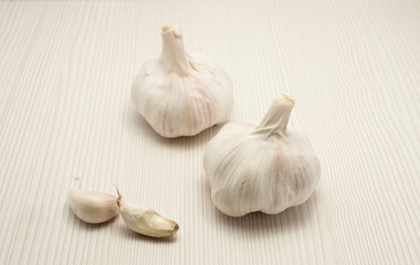two garlic close up and wood background