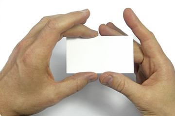 man hands holding a business card