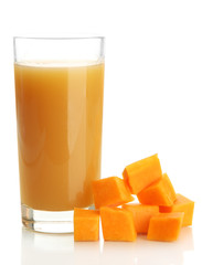 Glass of tasty pumpkin juice and pumpkin, isolated on white