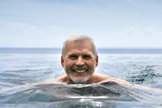 Elderly man swimming