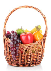 Different fruits in wicker basket isolated on white