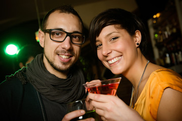 friends toasting at the disco