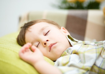 Cute little boy is sleeping