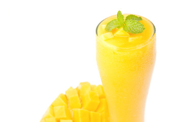 Fresh mango juice in a glass on white background
