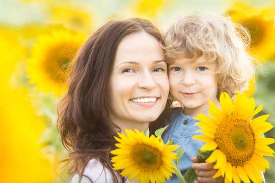 Happy family in sunflower field