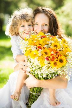Happy family with spring flowers