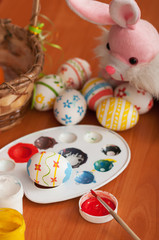 Easter eggs in the process of drawing