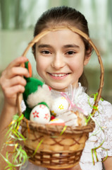 girl with a basket of Easter eggs