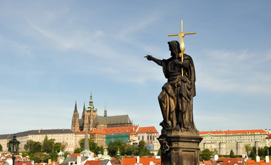 Obraz premium Saint John, the Baptist- statue on the Charles bridge in Prague